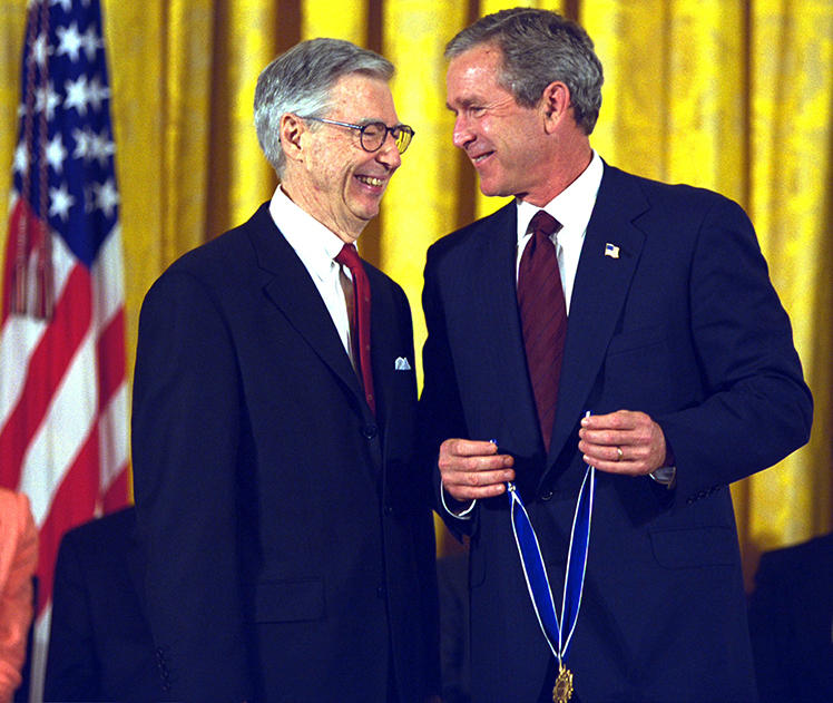 President George W. Bush presents the Presidential Medal of Freedom Award to Fred Rogers July 9, 2002, during ceremonies in the East Room. Courtesy of the George W. Bush Presidential Library